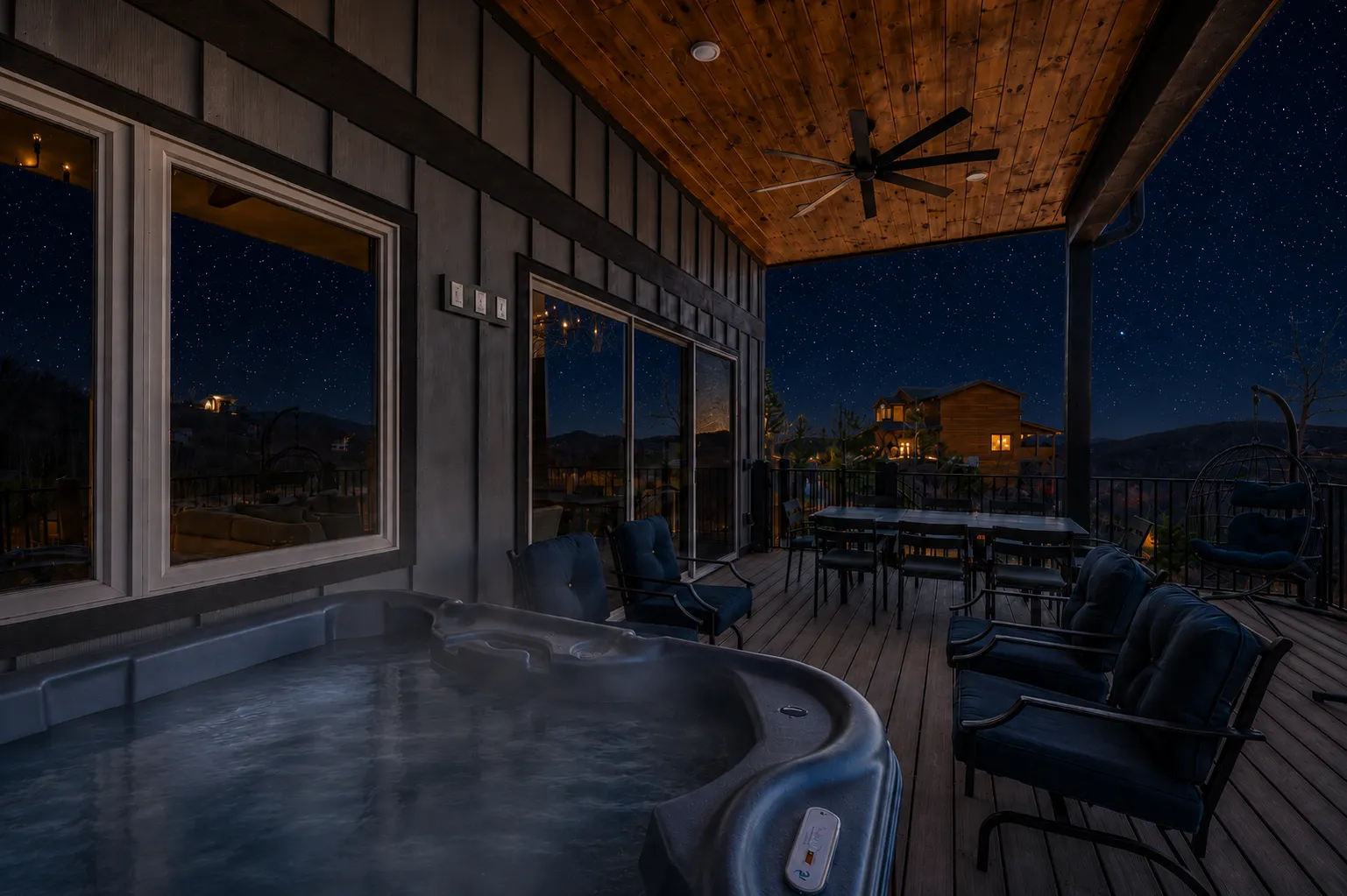 Star-filled night sky over dark mountain silhouettes